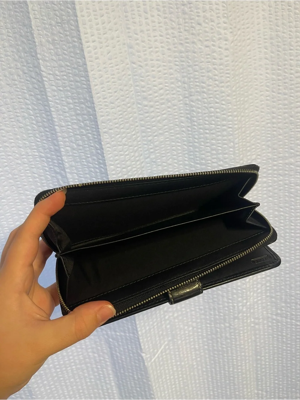 48. Coach wallet.